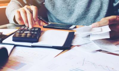 A man completed his small business bookkeeping for the month end