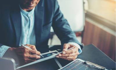 Businessman performing financial analysis