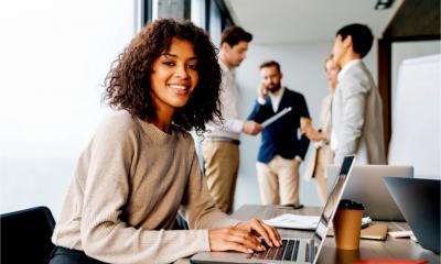 A woman settles happily into her new job