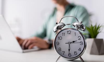 An alarm clock on an office desk