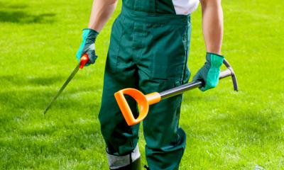 A gardener prepares for work by getting his tools out