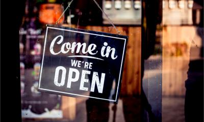 Come in we're open, vintage retro sign in cafe front