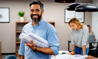 A smiling entrepreneur is confident about the future