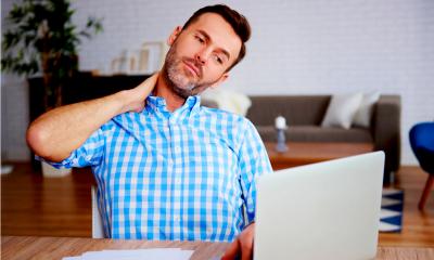 Mature entrepreneur suffering from neck pain Mature entrepreneur suffering from neck pain