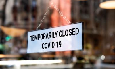 'Temporary closed COVID-19' sign outside small independent coffee shop in London