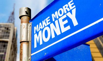 A blue sign saying make more money