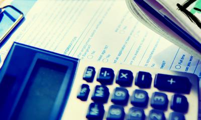 Out of focus calculator on an accountants desk